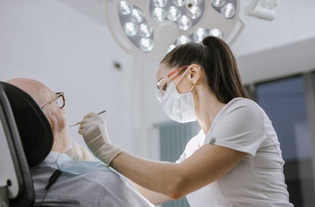 Dentist discussing dental implant treatment and cost with a patient at The Dental Ethics, Pune