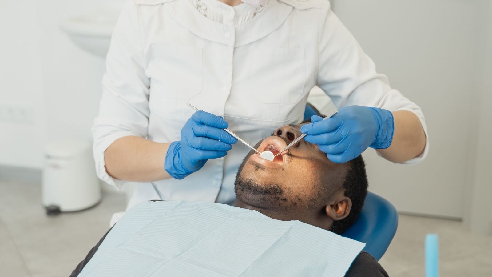 Dentist performing a gentle, comfortable root canal examination on a patient at The Dental Ethics, Pune