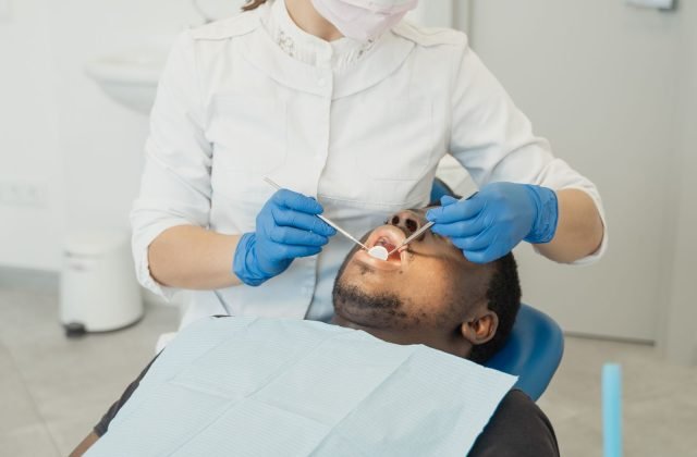 Dentist performing a gentle, comfortable root canal examination on a patient at The Dental Ethics, Pune